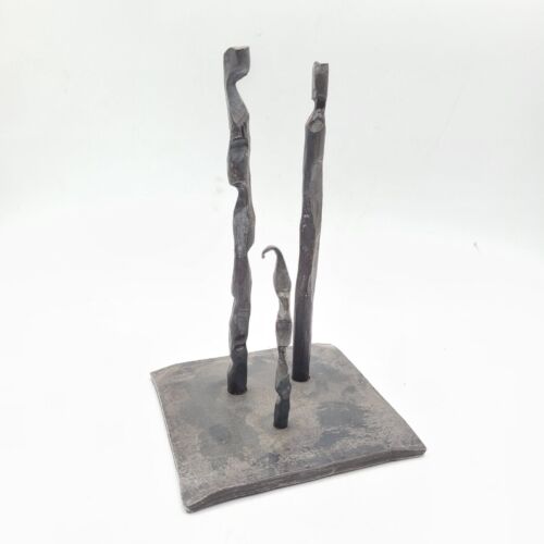 Metal Table Sculpture - Family- Modern Abstract Art One of a kind – original art by Nathaniel Winkler Family — Hand-Forged Table Sculpture This one of a kind hand-forged iron sculpture titled “Family” captures the strength, individuality, and connection shared between loved ones. Each figure is heated and shaped by hand, giving it a unique organic texture and graceful twist. Anchored on a solid steel base, the trio stands together in a simple yet powerful composition that celebrates unity and resilience. Perfect as a meaningful gift or as a timeless accent for your home, office, or entryway. Its minimalist design pairs beautifully with both rustic and modern interiors. Details: Material: Hand-forged steel Finish: Natural blackened iron with light protective wax Care: Wipe with a soft, dry cloth. If desired, apply a light coat of paste wax to maintain lust